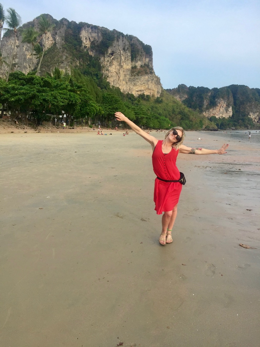 Hayley in a red dress on the beach
