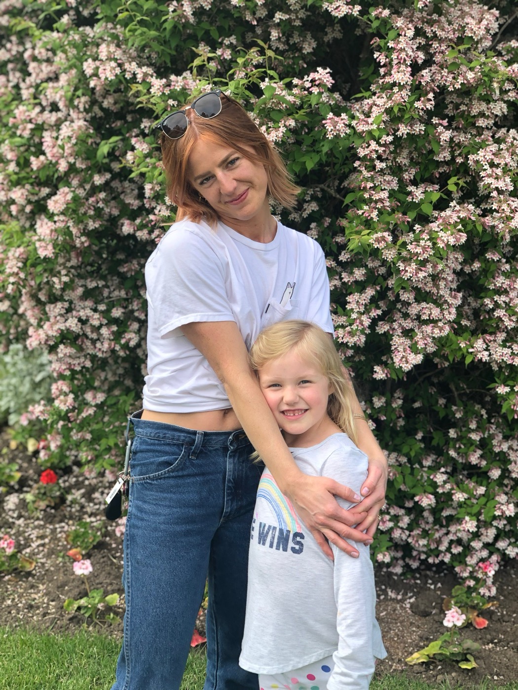 Hayley with her daughter among flowers